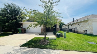 View of front facade featuring driveway, a garage