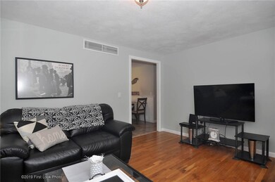 Living room with entry to dining area