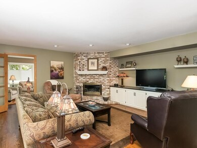 SPACIOUS MAIN LEVEL FAMILY ROOM WITH  FIREPLACE.  