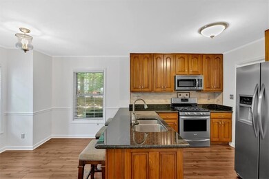 Kitchen with stainless steel appliances, a sink, c