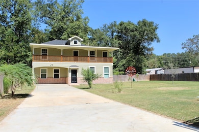 Long driveway to fit many vehicles or trailers.