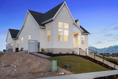 View of front of property featuring roof with shingles, a front lawn, stucco siding, and a mountain view