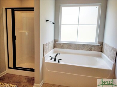 Master bath separate garden tub and shower.