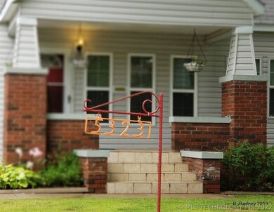 Inviting entry with stylish architectural detail!