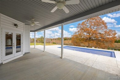 View of terrace with french doors and ceiling fan