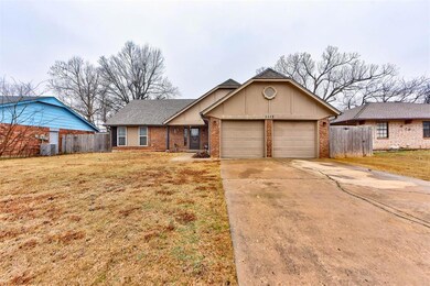 Ranch-style home featuring a garage, central AC un