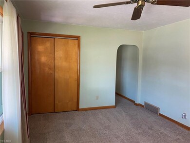 Living room coat closet and hallway going back to 