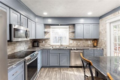 Fully remodeled kitchen. Cabinets are a dolphin gr