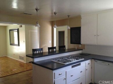 Remodeled  kitchen  with  breakfast  bar  and  upd
