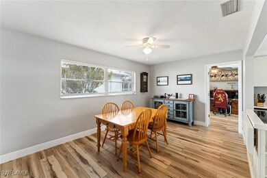 Dining space featuring ceiling fan and light wood-