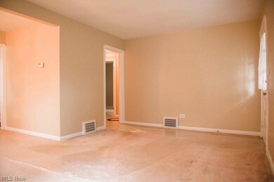 Living room connects to the hall.