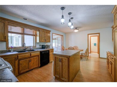 Kitchen with large window and center island.