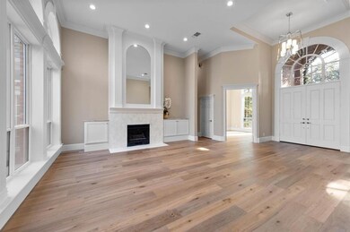 8' entry doors open to a light filled large formal living with 14' ceilings