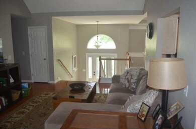 This is another look at the living room from the kitchen area looking towards the entry way