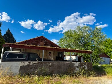 View of side of property with a carport