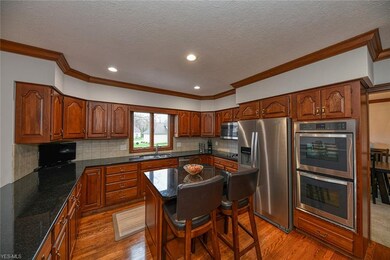 Cherry cabinets, granite counters, stainless steel