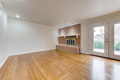 Unfurnished living room with light wood finished f