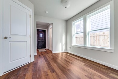 Empty room with wood finished floors and baseboard