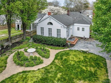 Rear view of property featuring a patio area and a