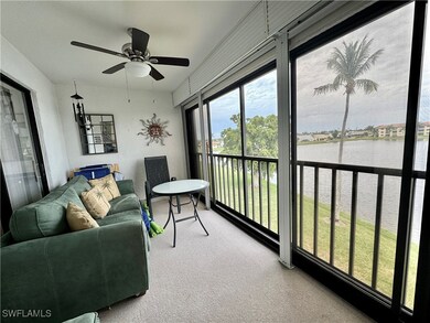 Sunroom / solarium with a water view and ceiling f