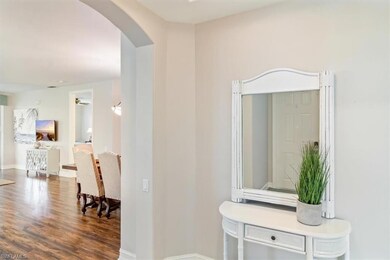 Hall with hardwood / wood-style flooring