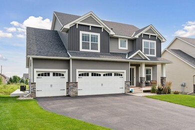 3 car garage with exterior stonework