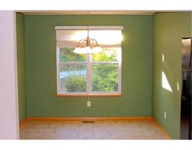 Kitchen. Cozy eat in kitchen area with tile flooring & natural light