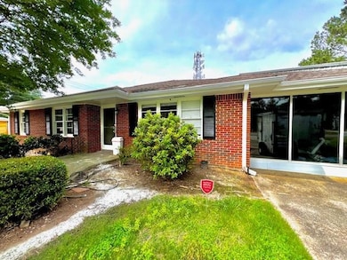 Ranch-style home with brick siding