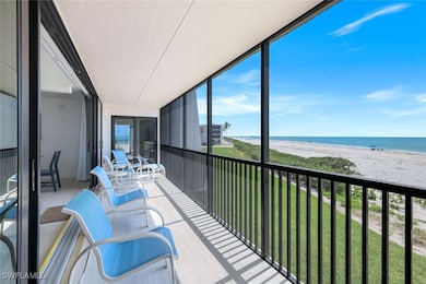Balcony with view of water and beach