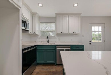 Kitchen featuring appliances with stainless steel 