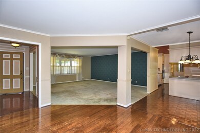 Entry hall on the left filled w/ beautiful trim an