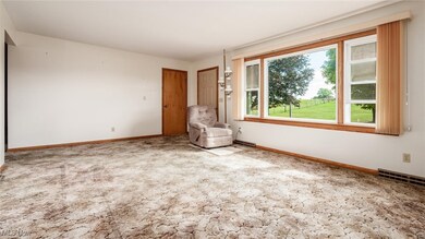 Unfurnished room featuring light carpet