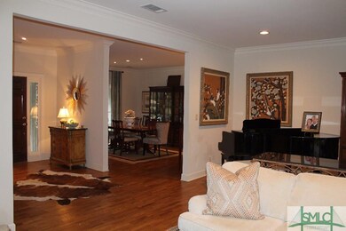 LIVING ROOM LOOKING INTO FOYER & DINING ROOM