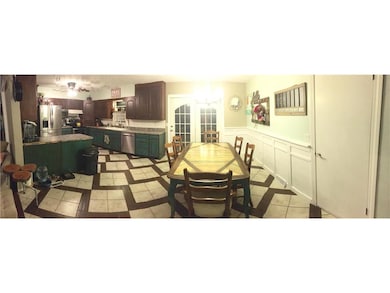 Dining and kitchen area with tile flooring. Lots o