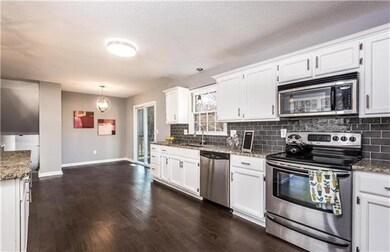 Stunning kitchen with granite countertops, white c
