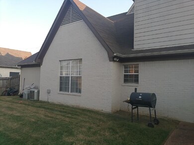 REAR OF HOME, PATIO AND LARGE MANICURED YARD
