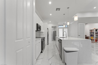 Kitchen with a sink, modern cabinets, appliances w