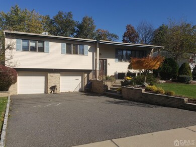 The two-car garage and blacktop driveway give you 