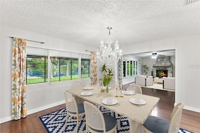 Virtually Staged Dining Room and Family Room overlooking Lake