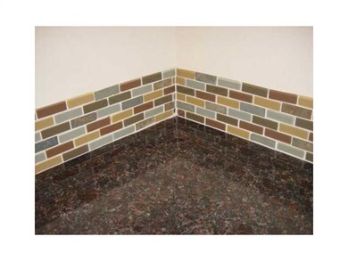 Kitchen. Detail of counter tops and back splash