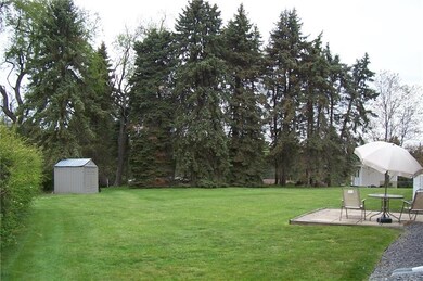 ENJOY THE TREE-LINED REAR YARD.