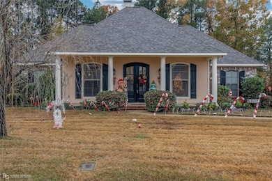 View of front of property featuring a front yard a