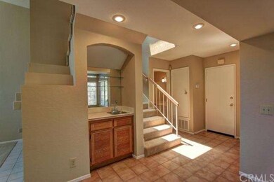 Entry way with Wet Bar, Powder room(w/Storage) and