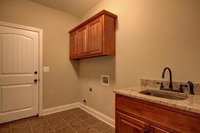 Cabinets and Laundry Sink with Granite Also