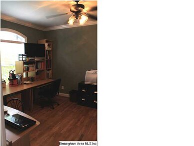 The formal living room is being used as a home off