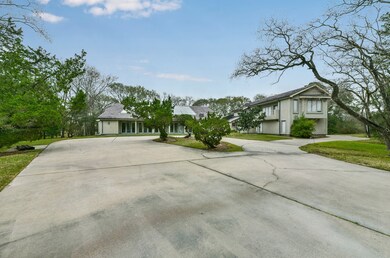 This is the front view of a truly one of a kind home! This perspective is deceiving, as it appears to be two buildings, but it is actually all the same home. The drive to the right side leads to a single car attached garage beneath the home's library.