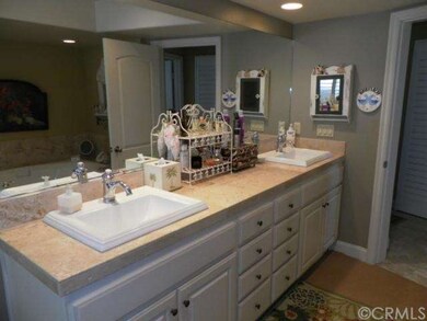 High cabinets Travertine counters, master bedroom 