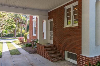 Entry into house from covered porte-cache.