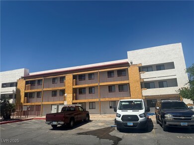 View of property featuring uncovered parking