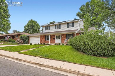 View of property with a garage, a front yard, and 